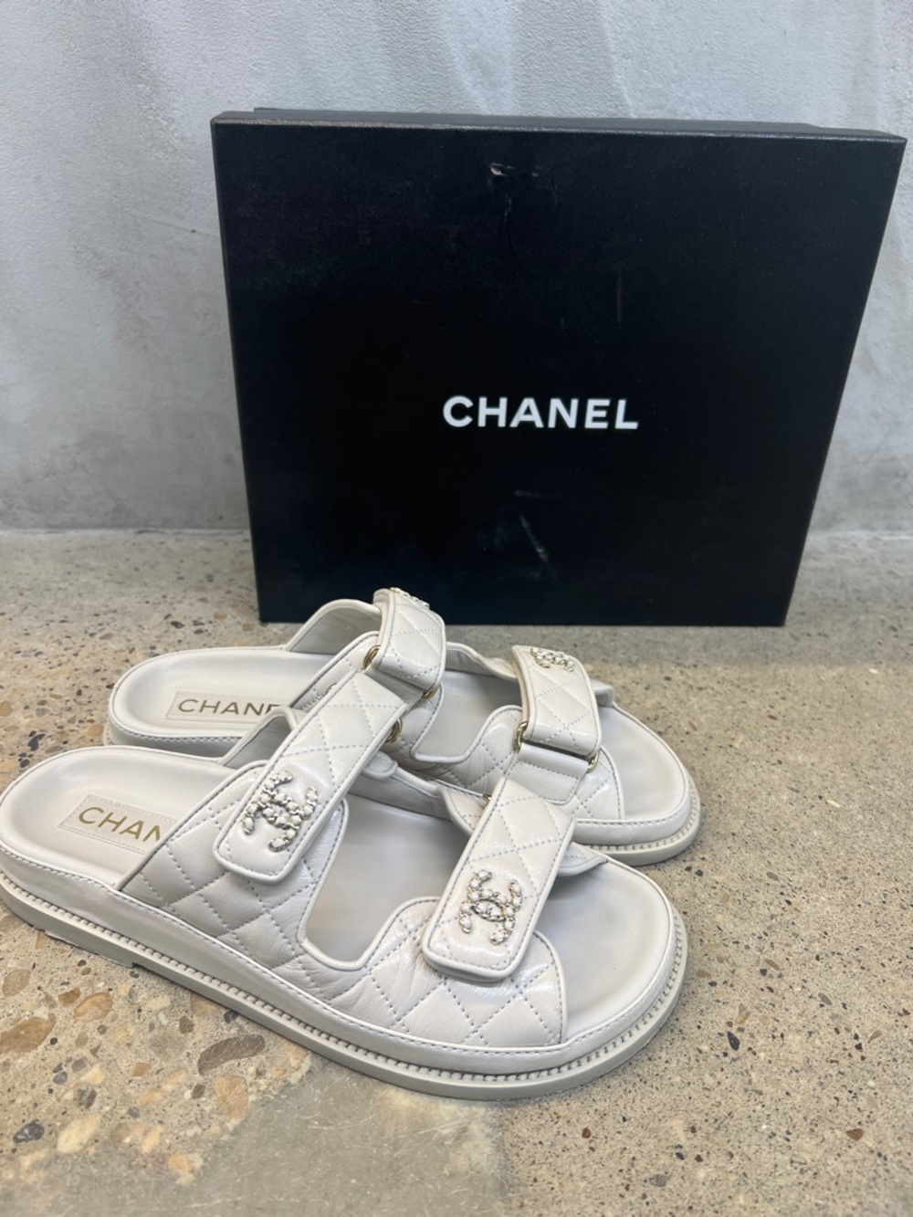 CHANEL Quilted Off-White Double Strap Slides with CC Embellishment